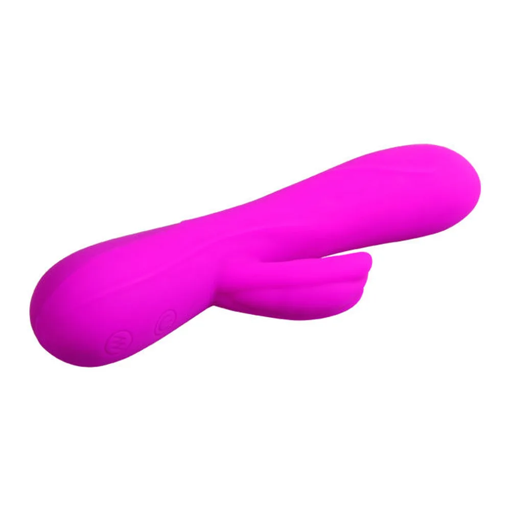 Vibromasseur en silicone magenta avec stimulateur de forme allongée et deux branches courtes de chaque côté, sur fond blanc
