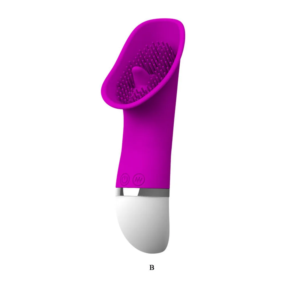 Stimulateur clitoridien magenta en silicone avec tête incurvée couverte de picots fins et anneau métallique au corps, sur fond blanc