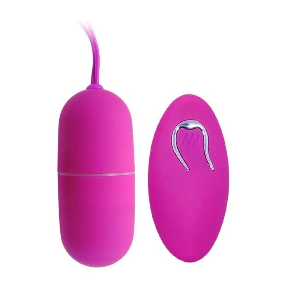 Œuf vibrant rose magenta avec cordon de retrait en silicone et télécommande radio rose magenta dotée d'un écran et de contrôles, sur fond blanc