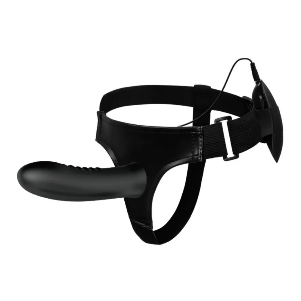 Gode-ceinture noir avec harnais ajustable affichant un insert creux vibrant, présenté sur mannequin neutre de couleur beige