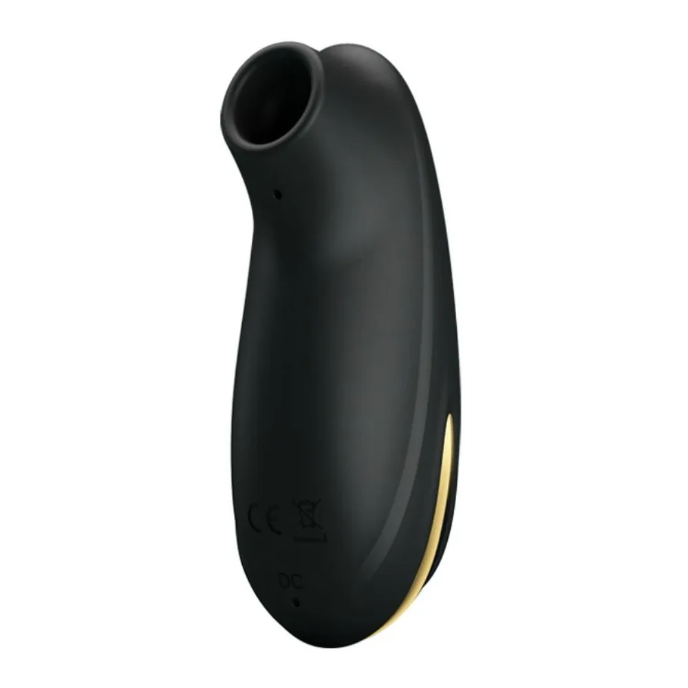 Stimulateur clitoridien noir en silicone, de forme ovoïde allongée avec ouverture ovale en haut, détail doré sur le côté, sur fond blanc