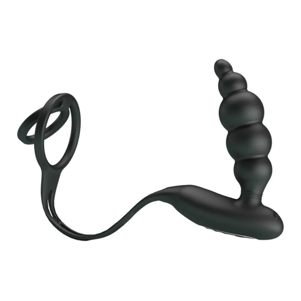 Anneau pénien noir en silicone relié par une sangle à un plug anal perlé vibrant, sur fond blanc