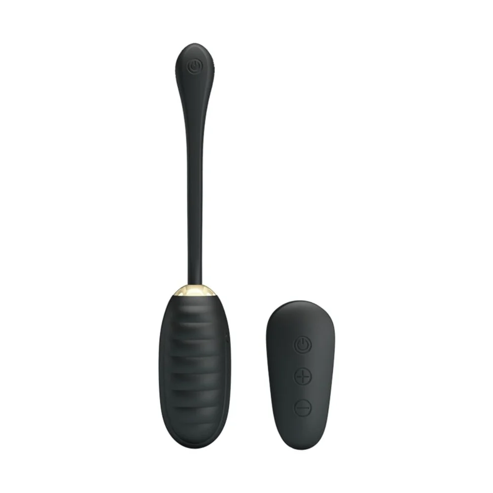 Œuf vibrant noir en silicone avec télécommande sans fil assortie, sur fond blanc