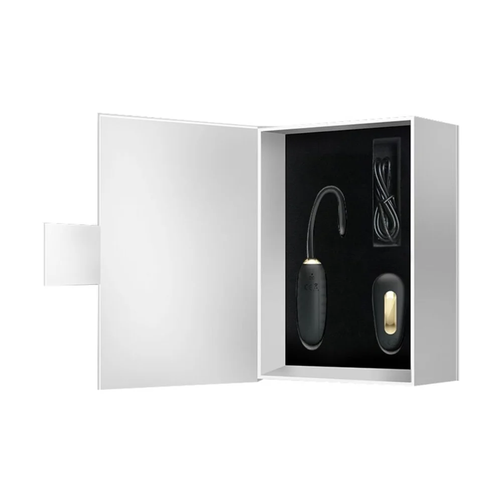 Œuf vibrant noir en silicone avec télécommande sans fil assortie, sur fond blanc