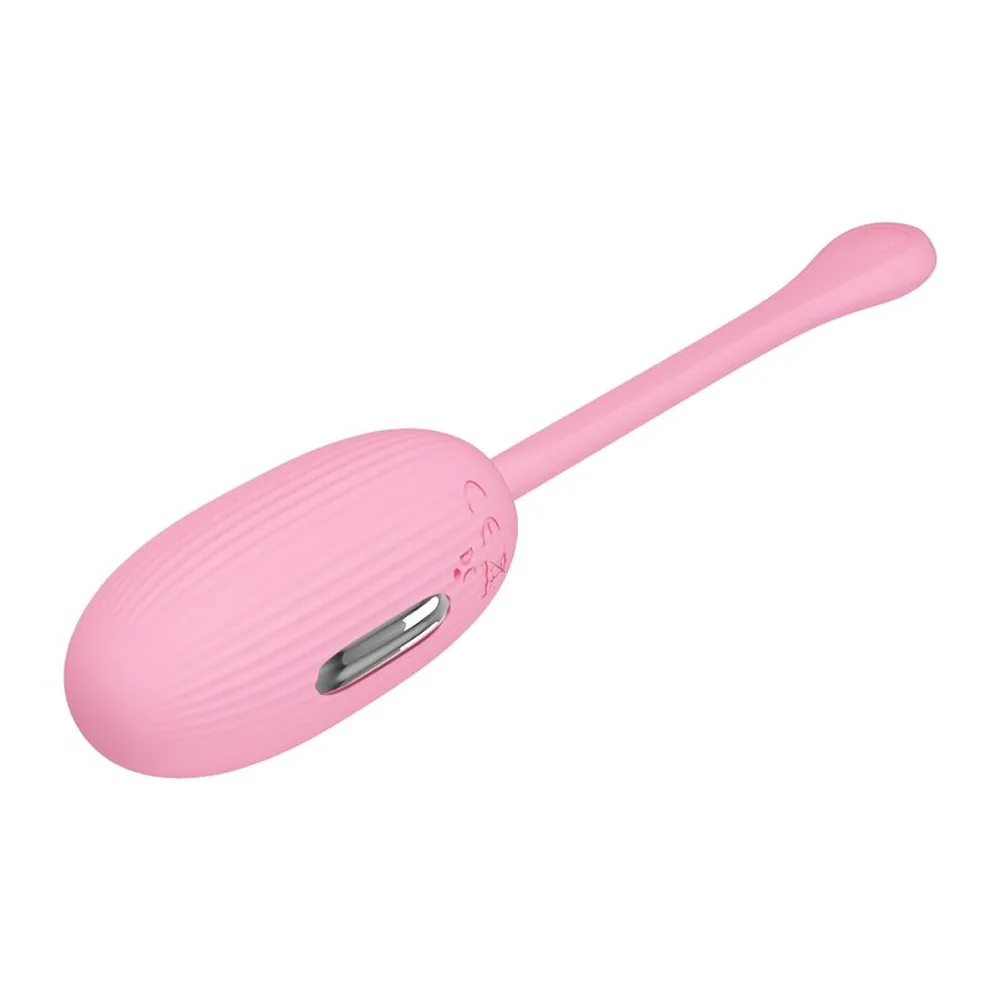 Œuf vibrant rose pâle avec handle allongé et arrondi, dotée d'une zone de commande sur le côté, corps lisse sur fond blanc