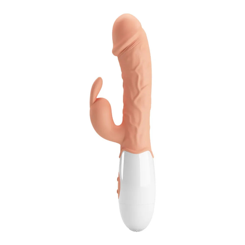Vibromasseur rabbit en silicone chair avec branche stimulatrice, base blanche, sur fond blanc