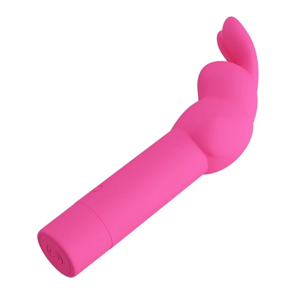 Vibromasseur rabbit rose vif en silicone, avec un corps cylindrique et des ailettes stimulantes à l'extrémité, sur fond blanc