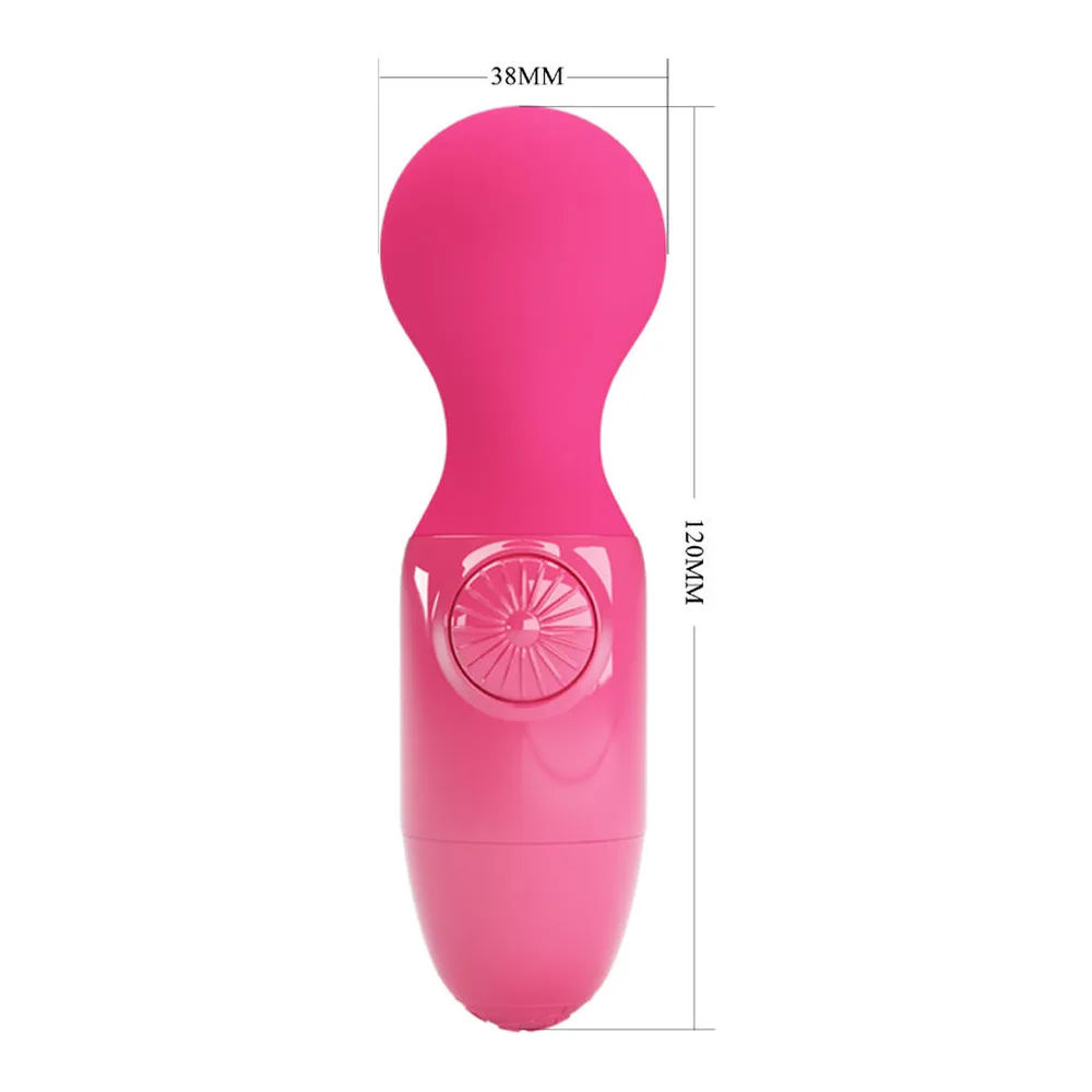 Mini masseur personnel en silicone magenta brillant, tête arrondie et corps compact avec contrôles latéraux, sur fond blanc