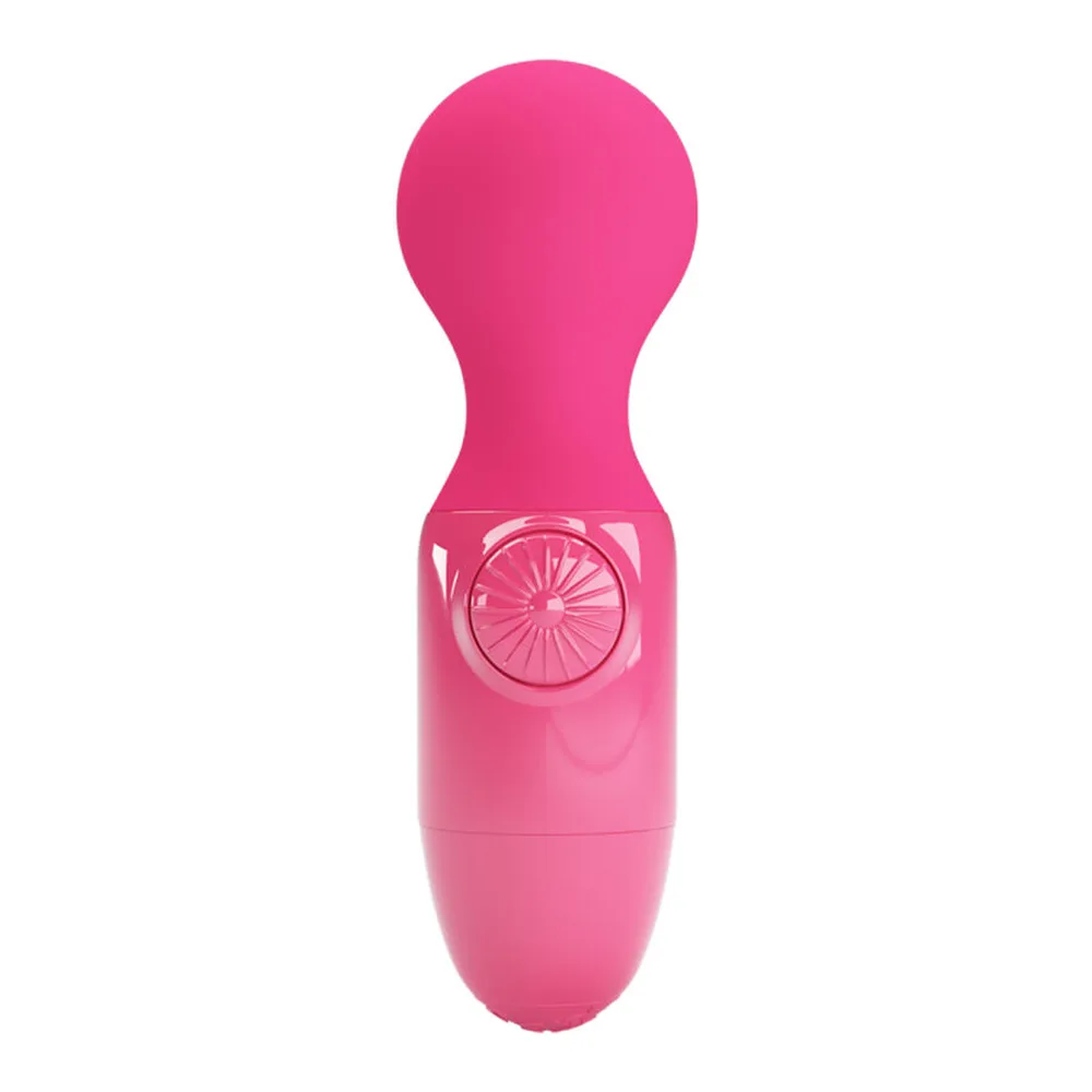 Mini masseur personnel en silicone magenta brillant, tête arrondie et corps compact avec contrôles latéraux, sur fond blanc
