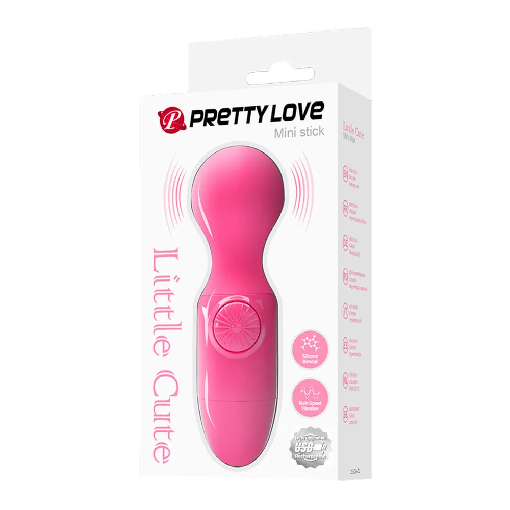 Mini masseur personnel en silicone magenta brillant, tête arrondie et corps compact avec contrôles latéraux, sur fond blanc