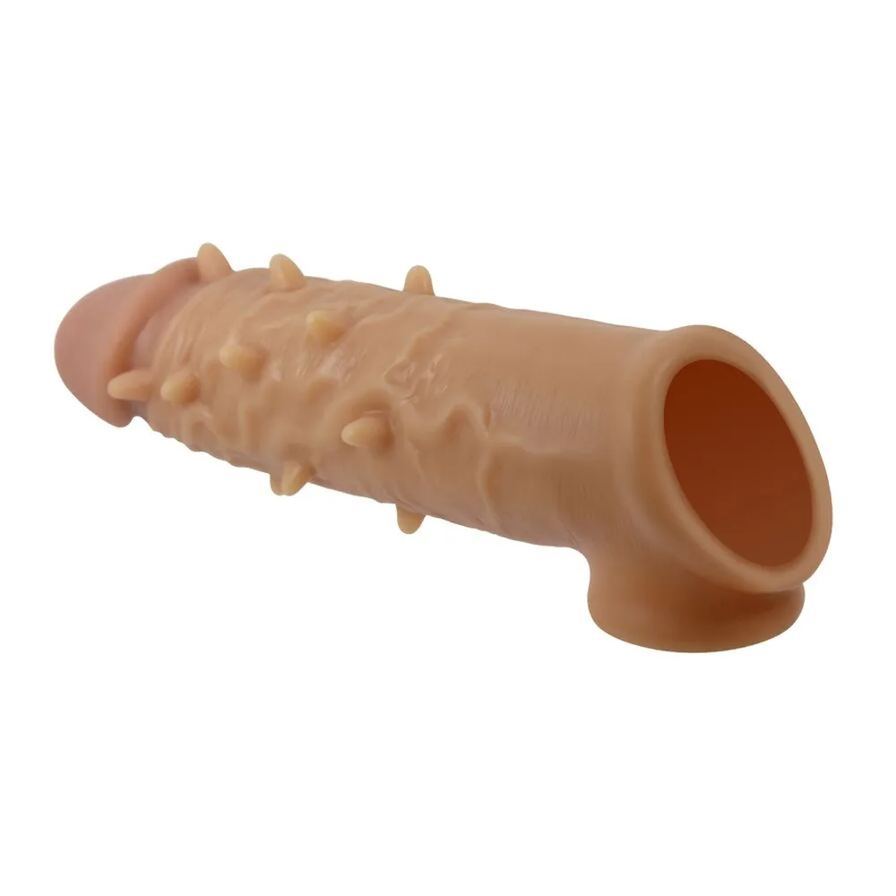 Gaine extensible en silicone beige chair, surface hérissée de picots, avec anneau testiculaire intégré et ouverture évasée
