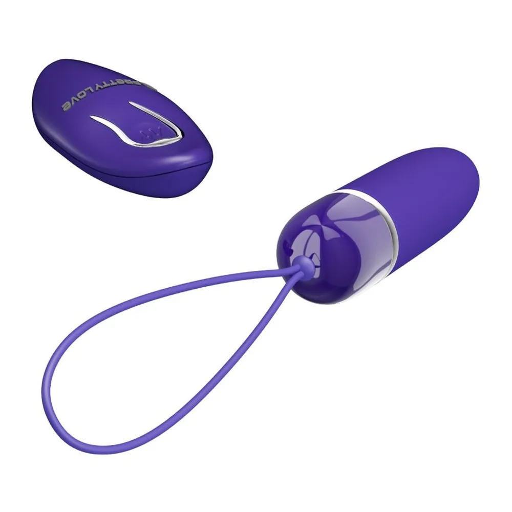 Emballage d'une balle vibrante violet foncé avec cordon de retrait, affichant le produit et sa télécommande sans fil en façade