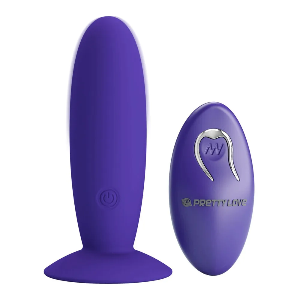 Plug anal violet en silicone avec base ventouse circulaire, accompagné de sa télécommande ovale violet foncé sur fond blanc