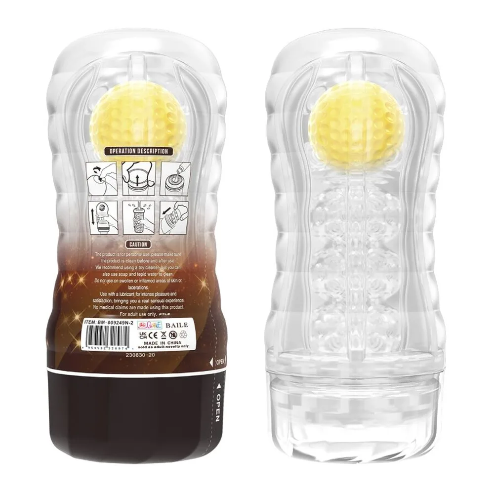 Masturbateur transparent avec bille jaune mobile visible à l'intérieur, corps blanc et marron, capuchon noir détachable, tenu en main avec orifice d'aération visible en haut