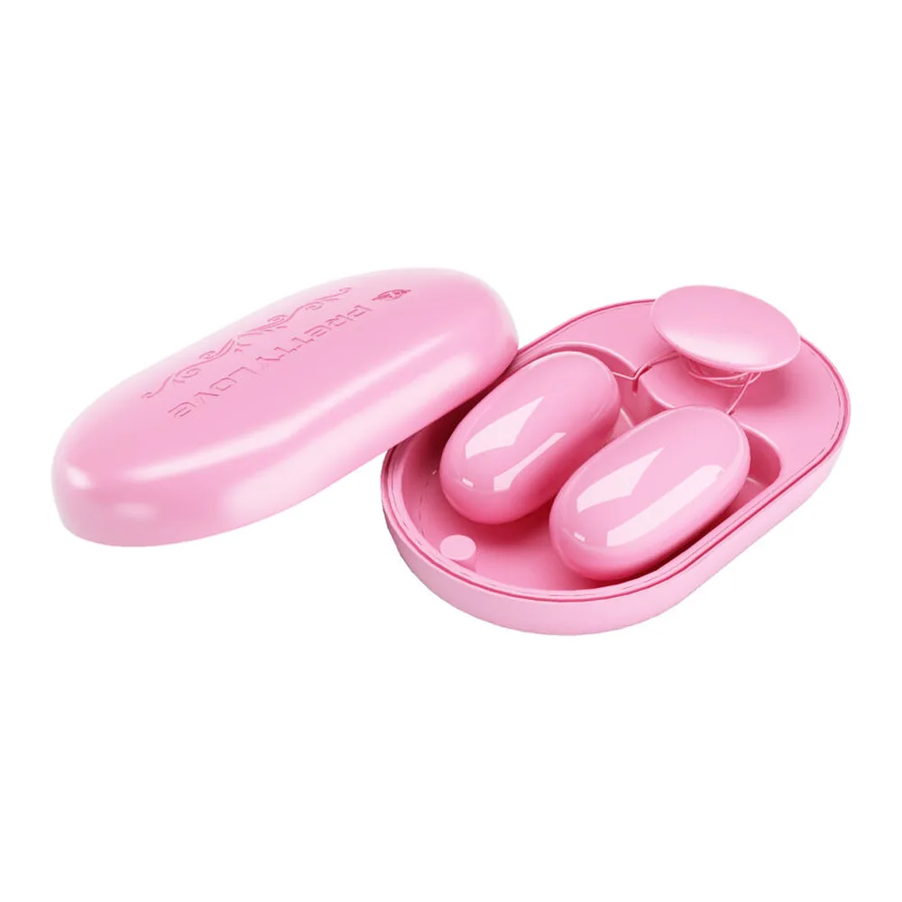 Balle vibrante rose avec télécommande filaire rose et boîtier de rangement ovale rose, présentés ensemble sur fond blanc