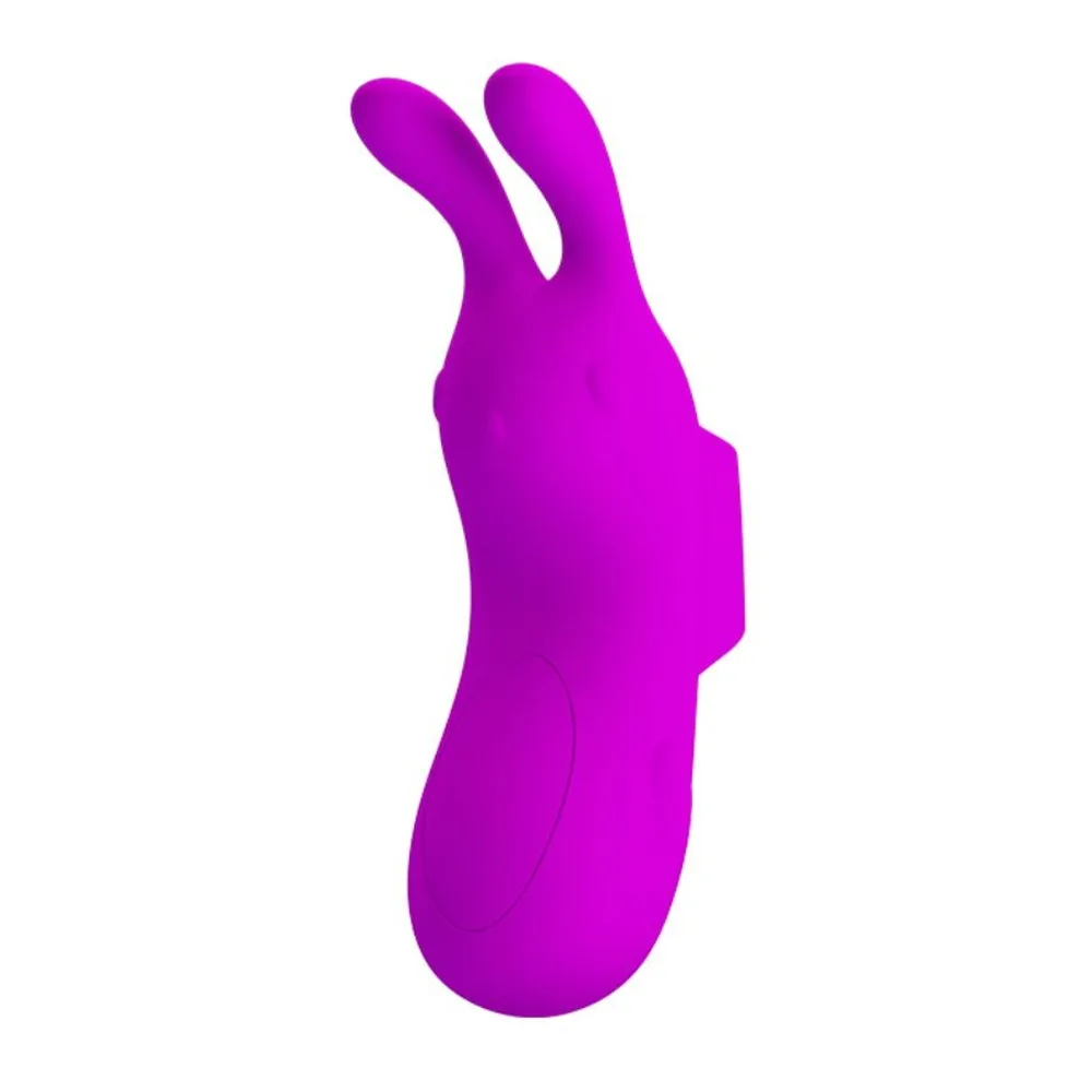 Vibromasseur en silicone magenta en forme de dé avec deux oreilles souples, conçu pour être enfilé au doigt, sur fond blanc