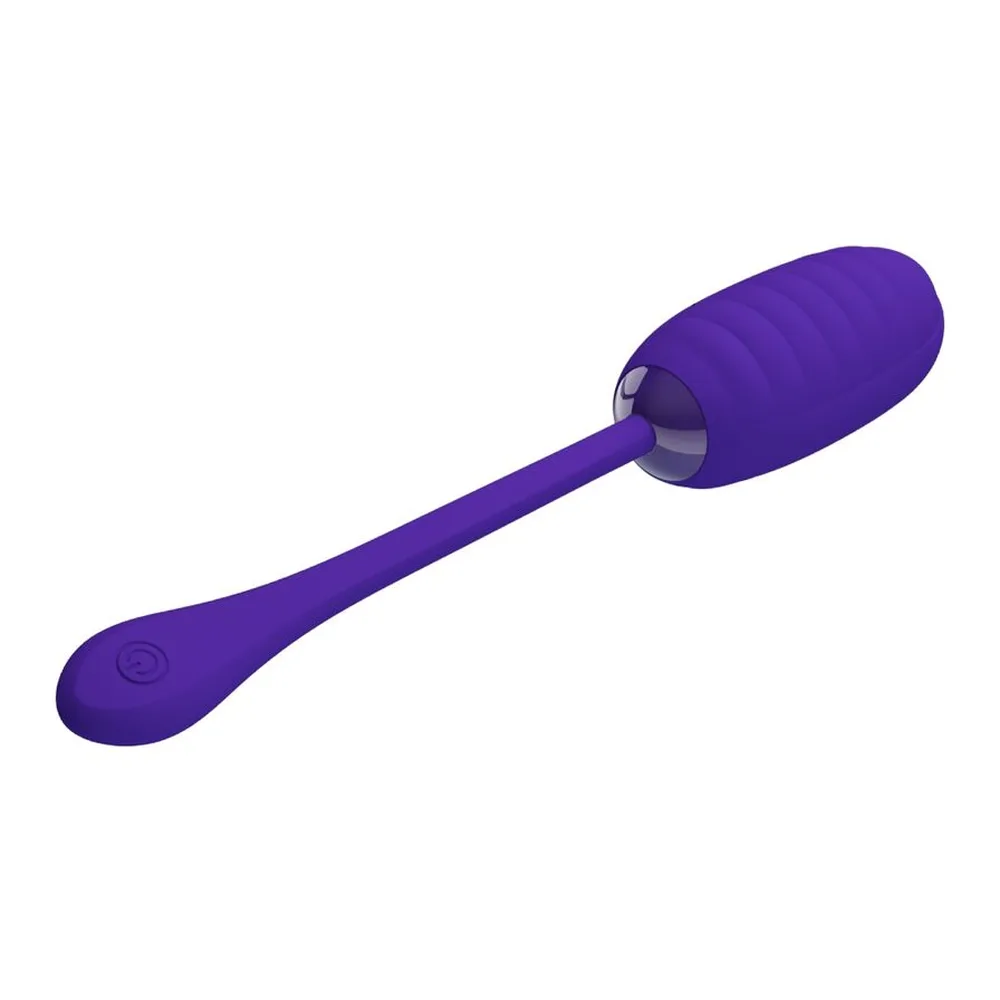 Œuf vibrant turquoise en silicone avec tige souple, orifice de charge visible sur le corps, fond blanc
