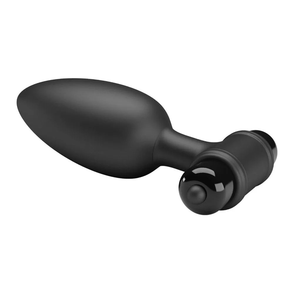 Plug anal noir en silicone avec base bulbeuse, module vibrant amovible montrant ses contrôles et compartiment à batterie AAA, sur fond blanc