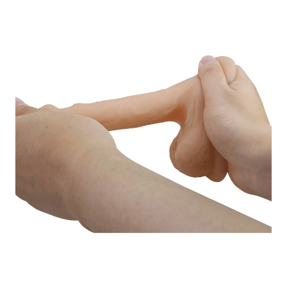 Gode réaliste en silicone chair, forme anatomique compacte avec testicules, texture lisse, fond blanc