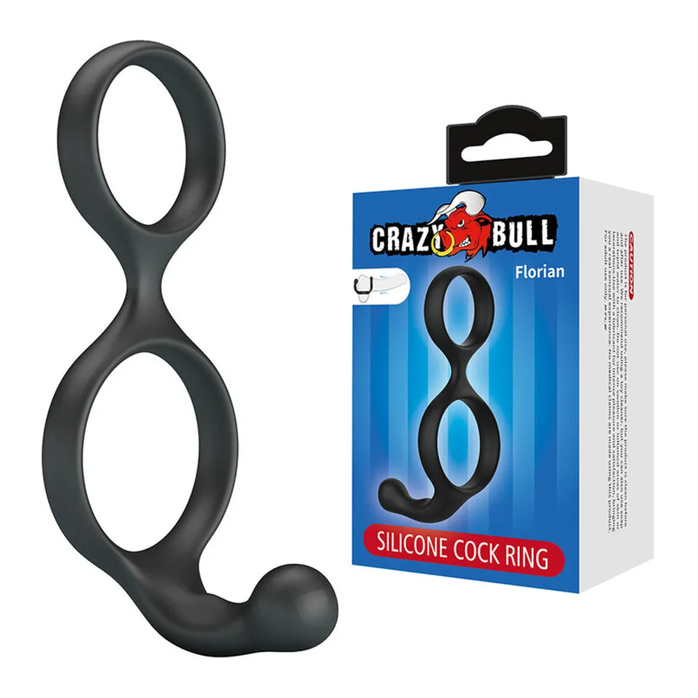 Double anneau de silicone noir souple avec deux boucles ovales reliées par une zone proéminente, présenté à gauche seul et à droite dans son emballage Crazy Bull Florian