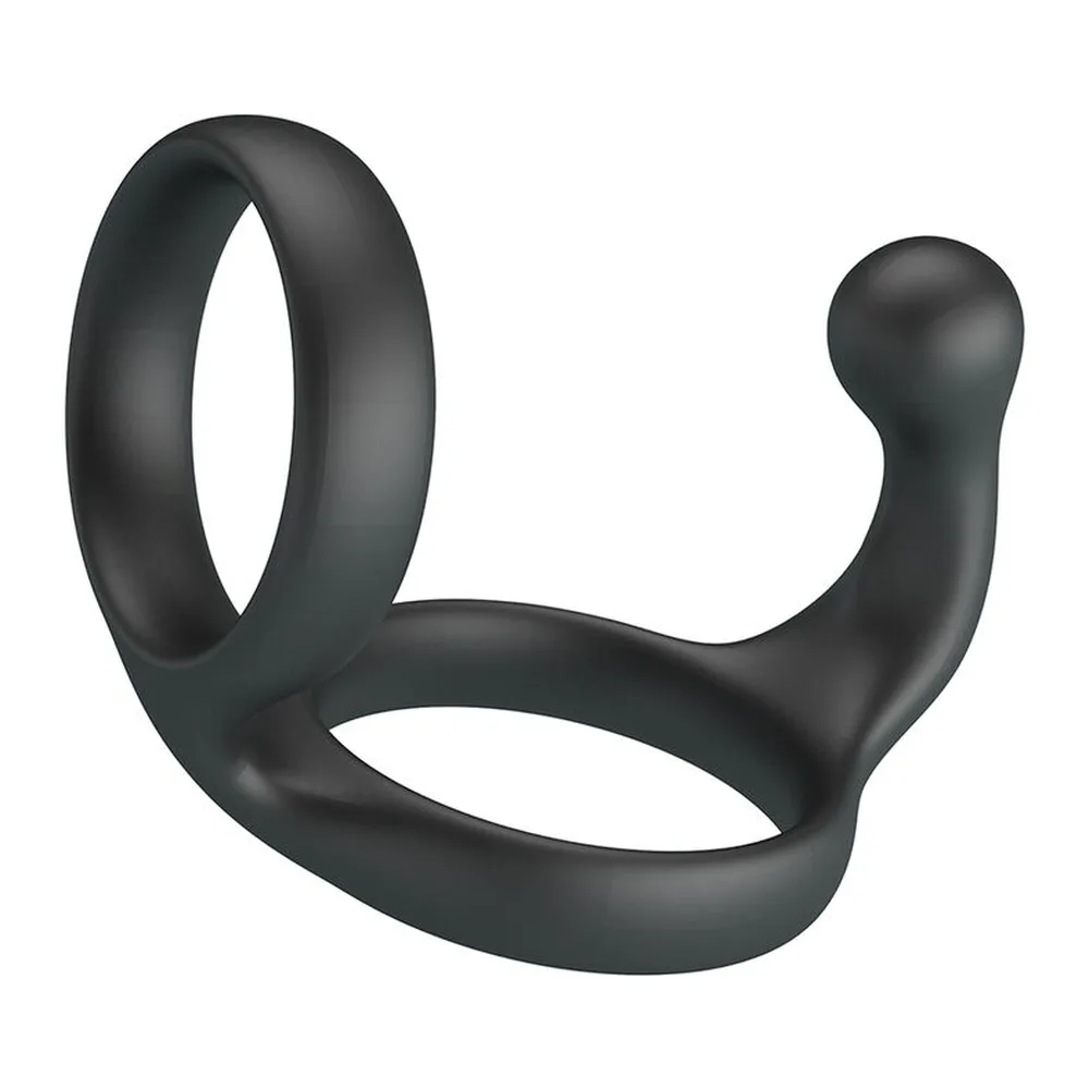 Double anneau de silicone noir souple avec deux boucles ovales reliées par une zone proéminente, présenté à gauche seul et à droite dans son emballage Crazy Bull Florian