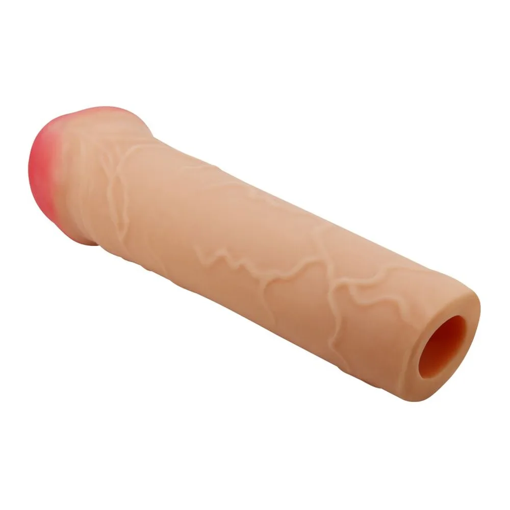 Gaine de pénis en silicone beige clair avec gland rose, texture réaliste en relief, sur fond blanc