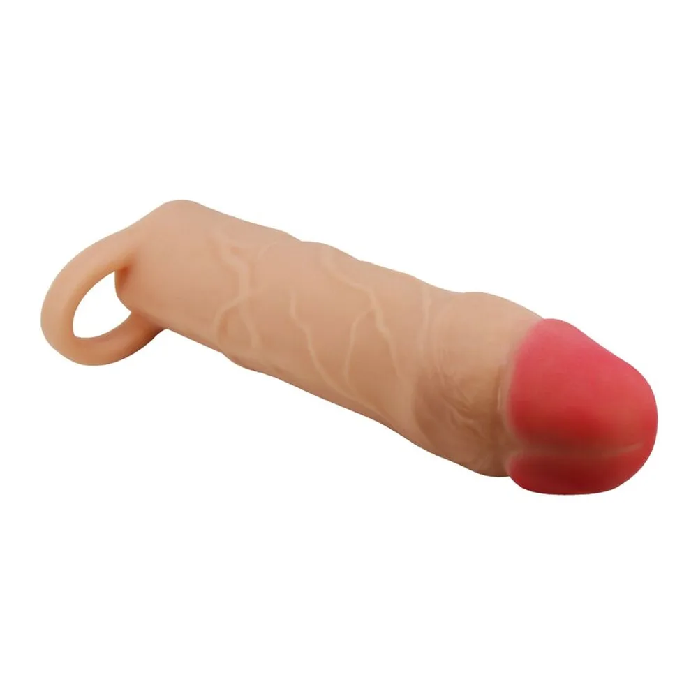 Gaine extensible en silicone beige clair avec anneau testiculaire intégré et extrémité rose arrondie, sur fond blanc