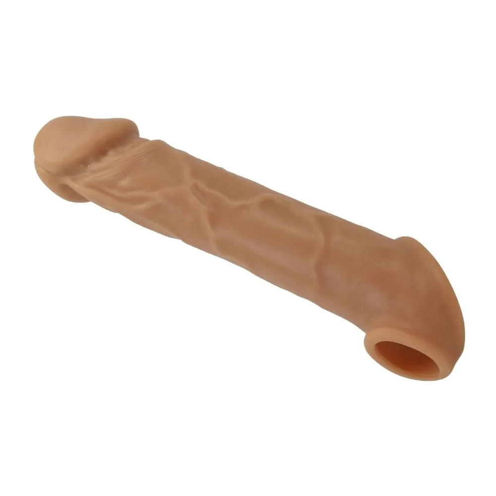 Manchon de pénis en silicone beige, aspect peau réaliste avec veines en relief, bout fermé et anneau d'enfilage à la base, sur fond blanc