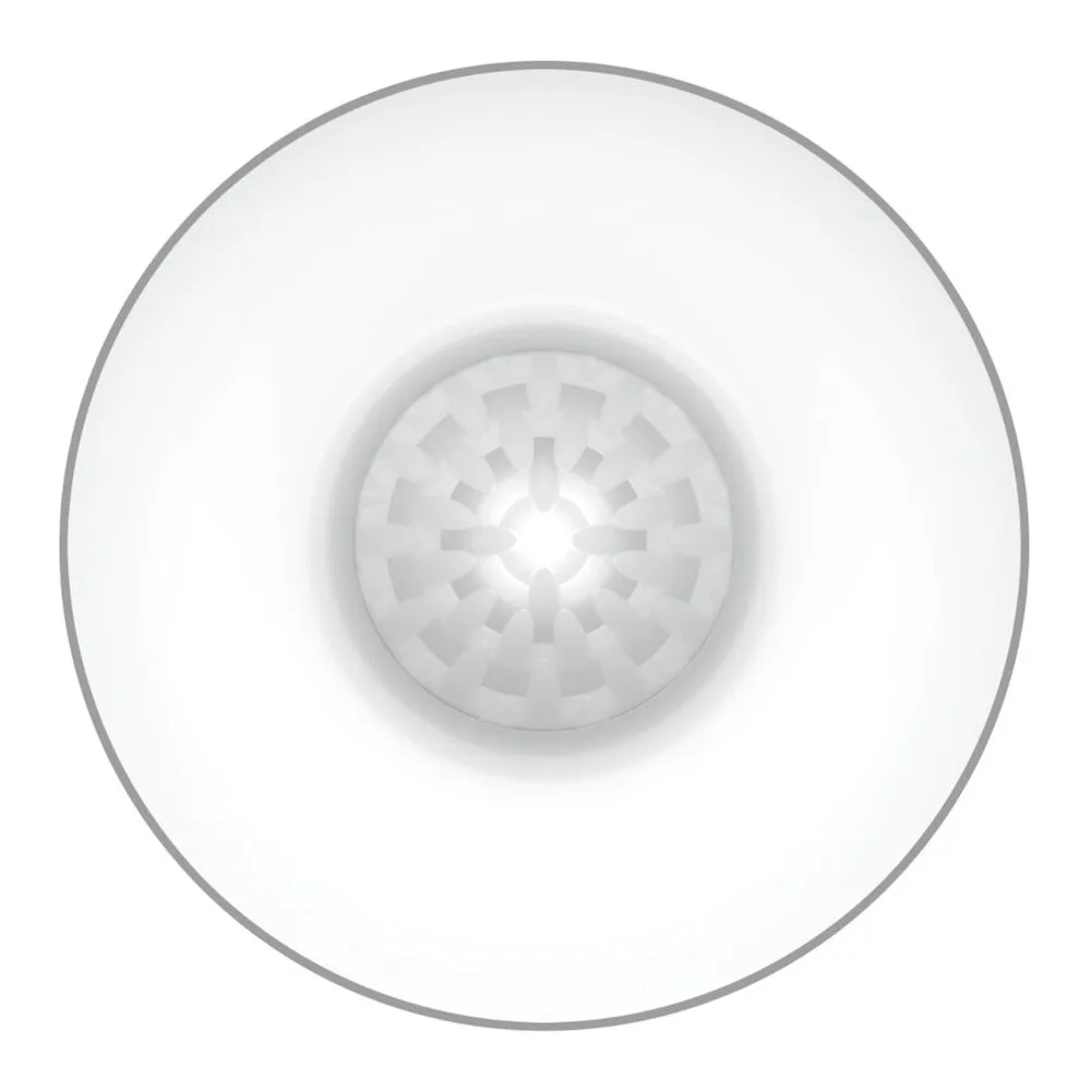 Masturbateur blanc en forme d'œuf, vue de dessus montrant la surface texturée avec motifs géométriques en relief et zone centrale brillante sur fond blanc
