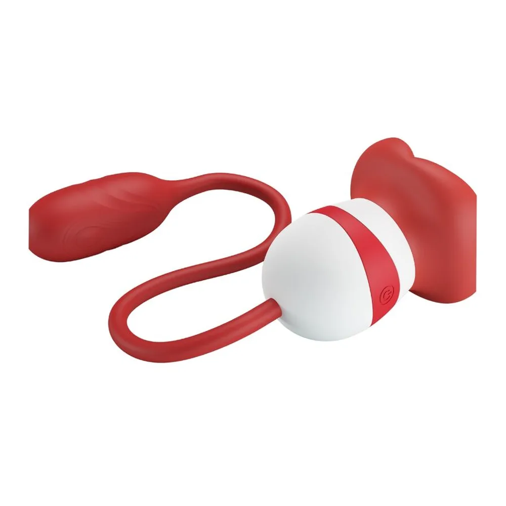 Stimulateur clitoridien avec succion en silicone rouge et blanc, tête de bouche ronde reliée par câble souple à commande œuf blanc et rouge