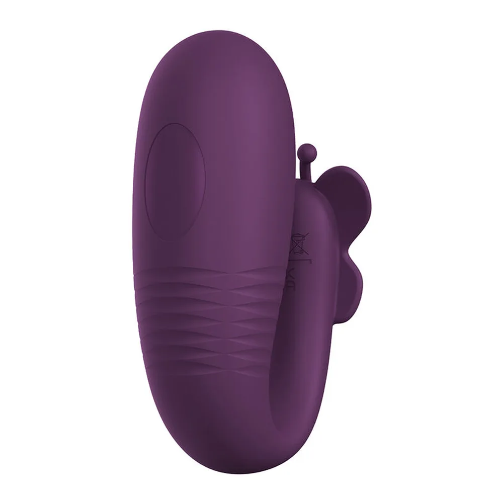 Œuf vibrant en silicone violet prune avec bras externe articulé et stimulateur clitoridien sphérique, vue de trois-quarts sur fond blanc