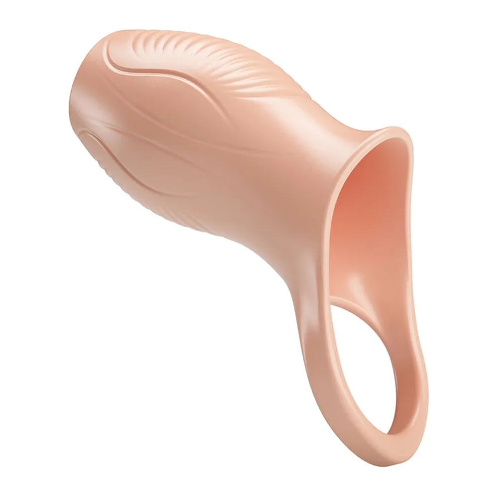 Gaine épaississante en silicone beige clair avec détails nervurés internes visibles, poignée d'insertion en anneau, forme ergonomique