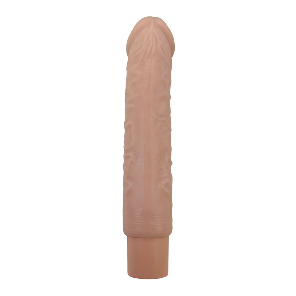 Vibromasseur flexible en silicone beige clair avec tête réaliste, corps texturé et socle de rechargement intégré, sur fond blanc