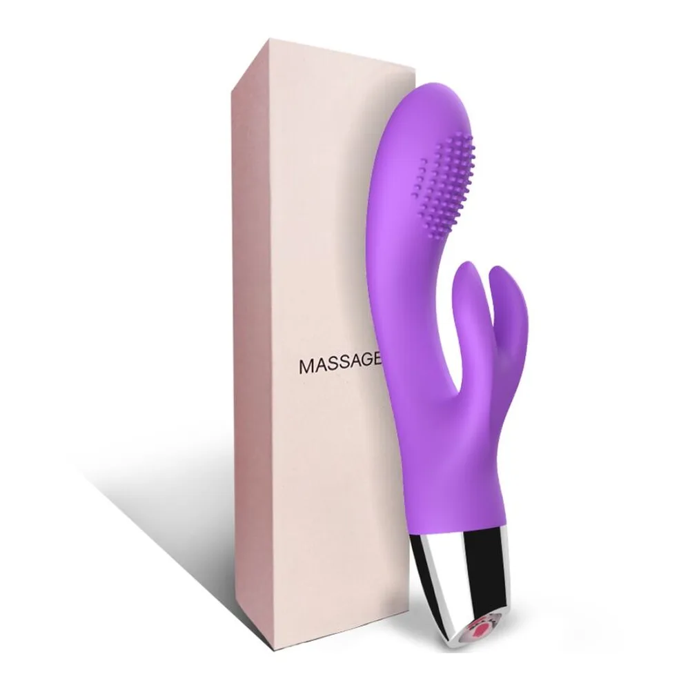 Vibromasseur rabbit violet avec bras clitoridien à picots, corps courbé et embout arrondi, présenté avec son emballage rose pâle