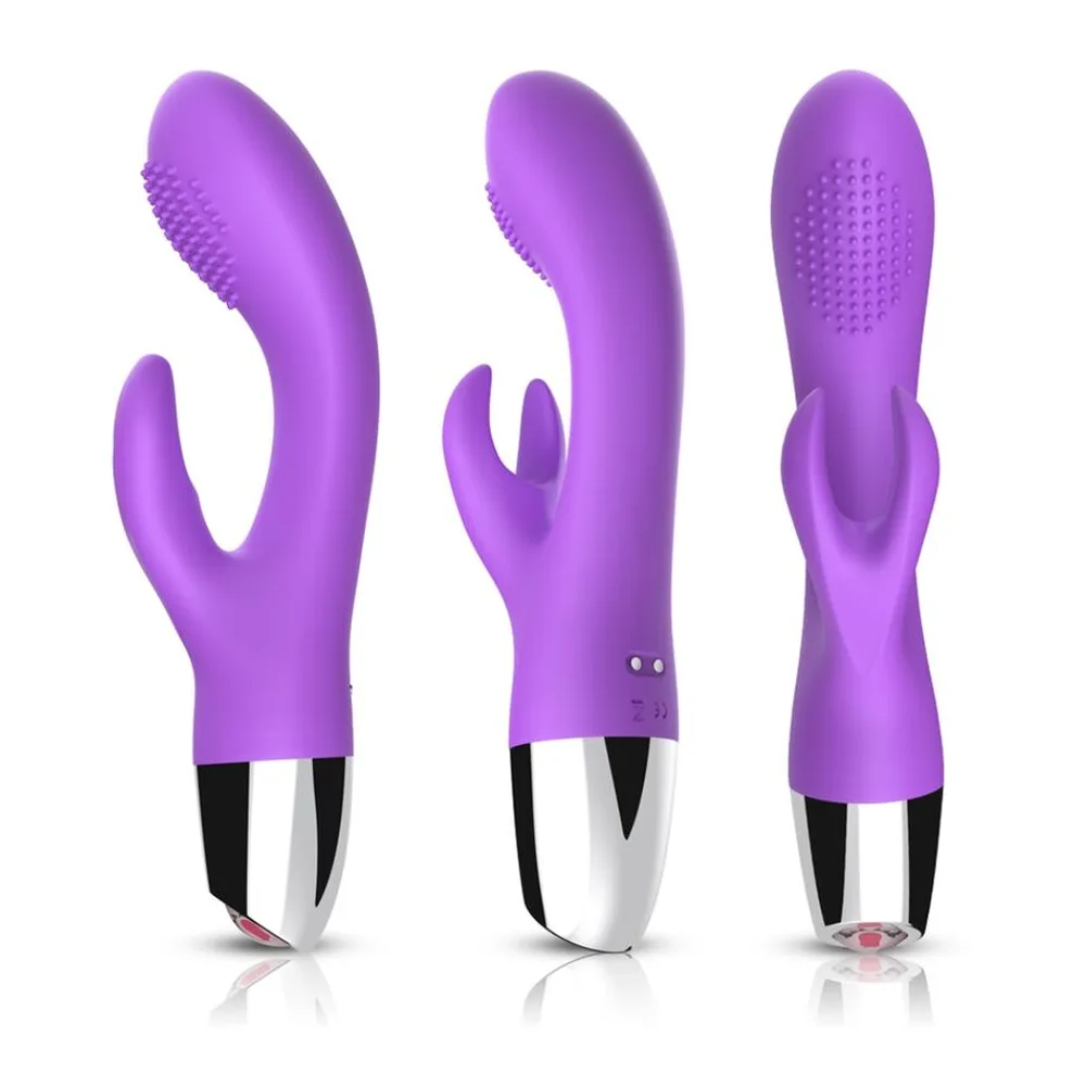 Vibromasseur rabbit violet avec bras clitoridien à picots, corps courbé et embout arrondi, présenté avec son emballage rose pâle