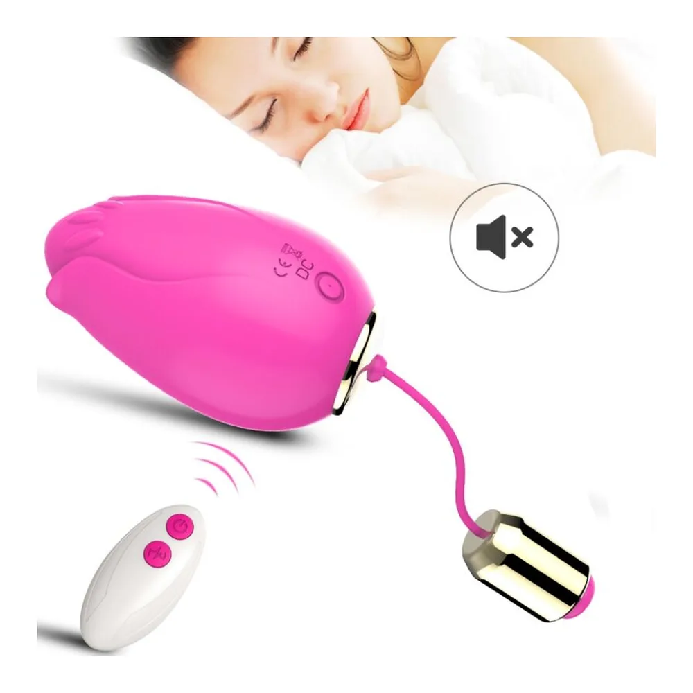 Deux œufs vibrants rose fuchsia en silicone avec formes de pétales, reliés par un cordon rose et or à une télécommande grise, présentés avec leur boîte colorée