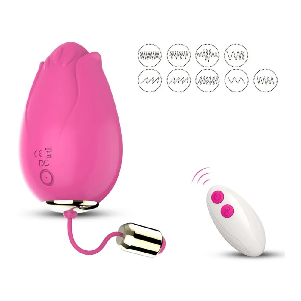 Deux œufs vibrants rose fuchsia en silicone avec formes de pétales, reliés par un cordon rose et or à une télécommande grise, présentés avec leur boîte colorée
