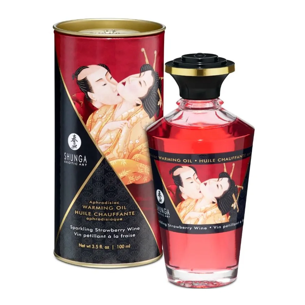 Flacon et emballage cylindrique d'huile de massage chauffante aux fraises et cava Shunga, verre teinté rose, bouchon noir doré, étiquette illustrée de personnages japonais en robe traditionnelle orange