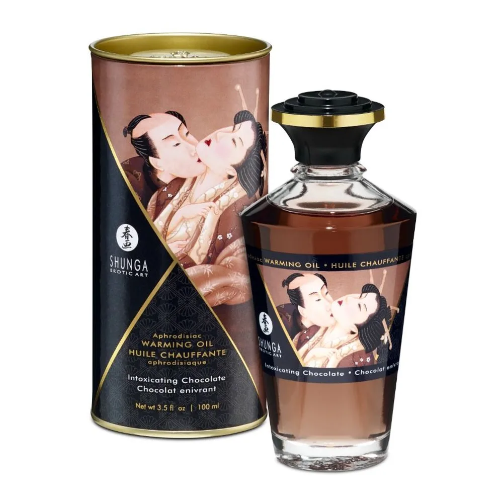 Huile de massage chauffante Shunga au chocolat intense, en flacon de 100 ml avec bouchon noir et doré, accompagné de son emballage cylindrique orné d'une illustration traditionnelle
