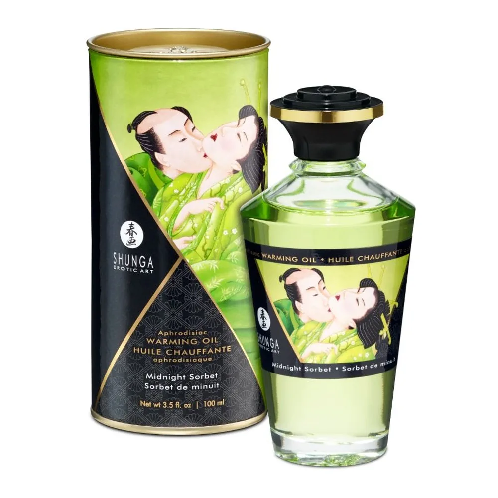 Flacon en verre de 100 ml d'huile de massage chauffante Shunga avec bouchon noir et doré, accompagné de son emballage cylindrique noir et vert anis orné d'illustrations asiatiques