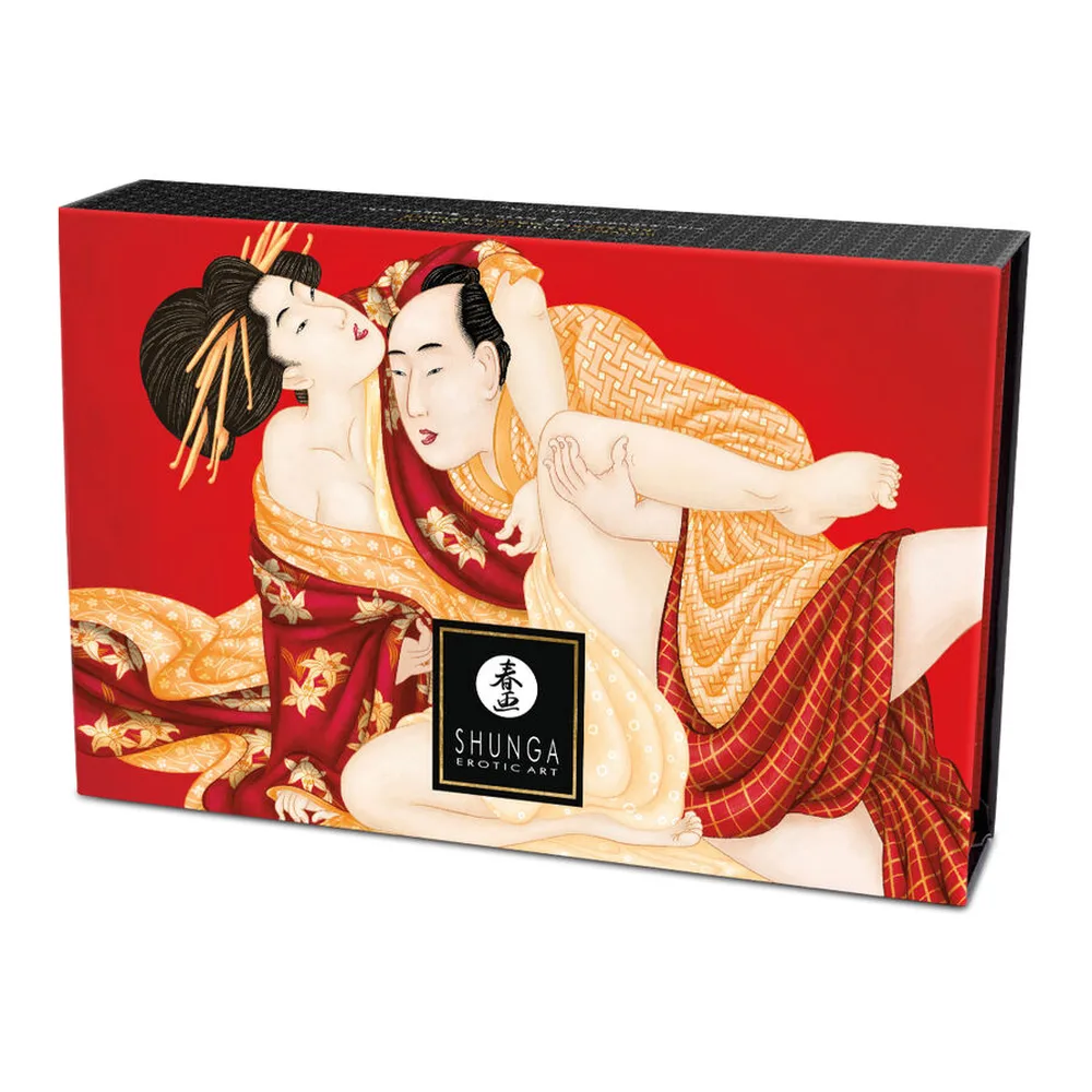 Boîte de kit de massage Shunga sur fond rouge, illustrée de deux figures en kimonos colorés, avec logo noir et texte blanc, emballage avec pinceau plume visible