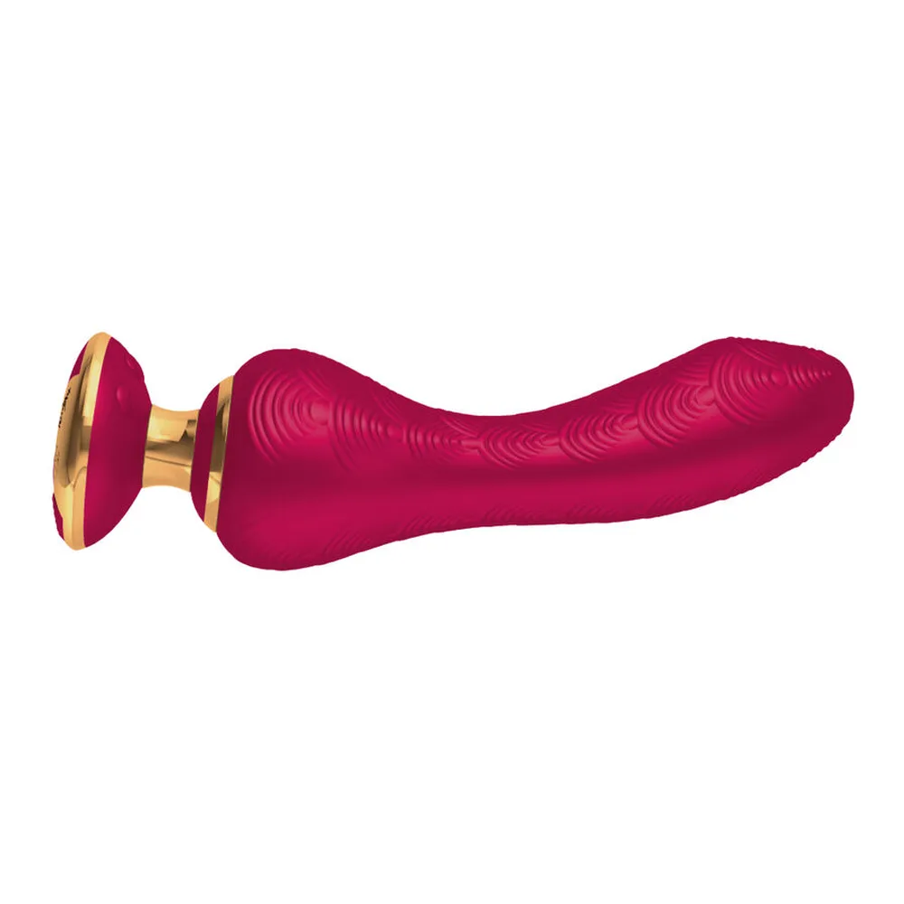 Vibromasseur rose vif avec embout flexible ondulé et base dorée circulaire, sur fond blanc