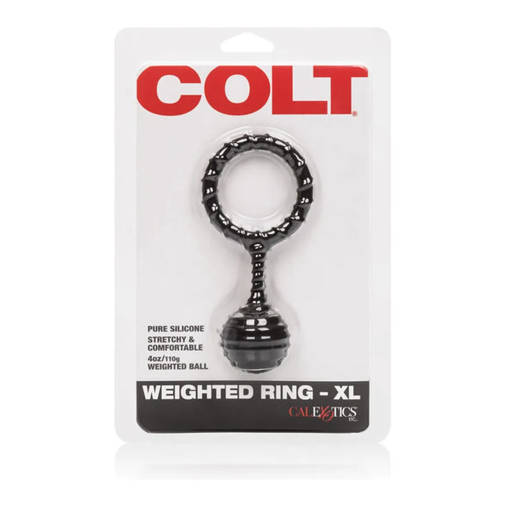 Cockring en silicone noir avec boule lestée reliée par un anneau texturé extensible, sur fond blanc