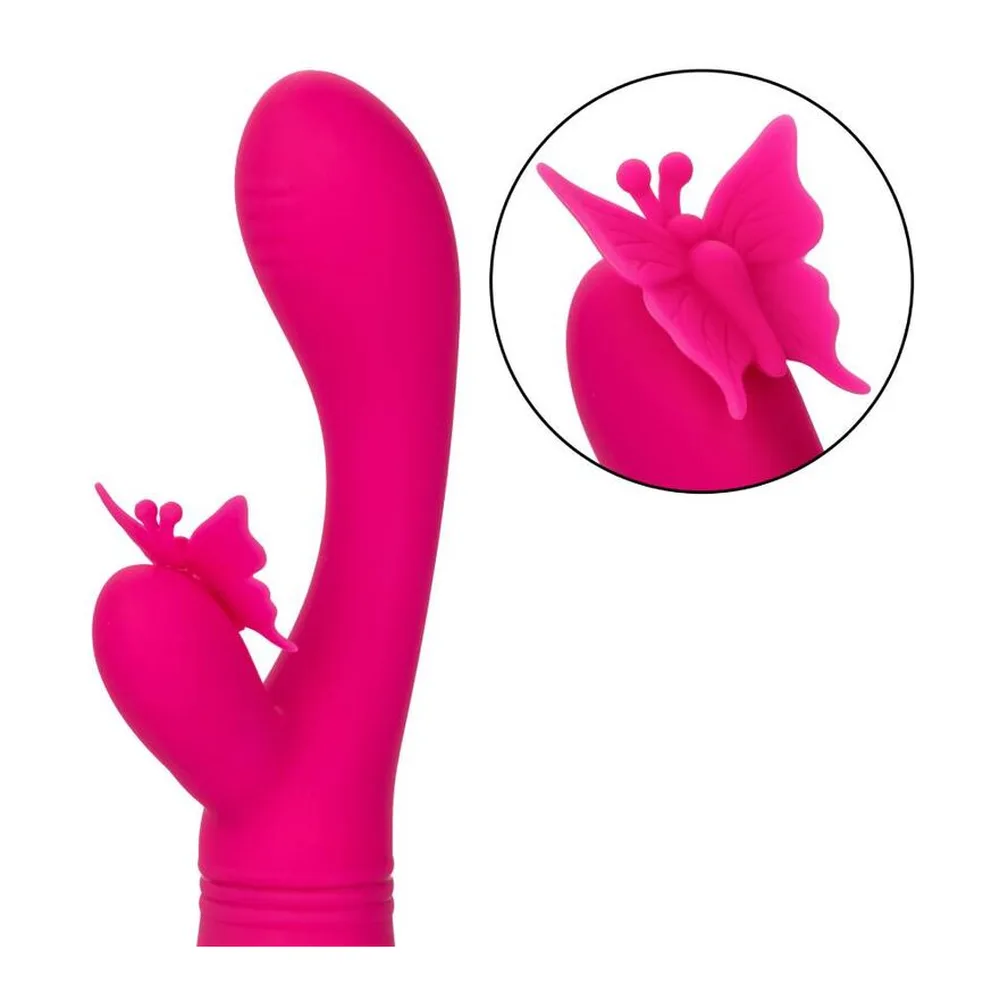 Vibromasseur rabbit en silicone rose fuchsia avec ailes de papillon articulées au niveau du clitoris et motifs texturés en relief à la base, fond blanc