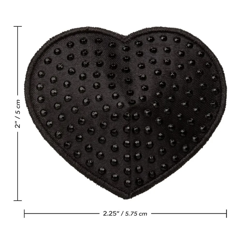 Cache-téton en forme de cœur noir en matière souple, constellé de petites perles argentées sur toute la surface, sur fond blanc