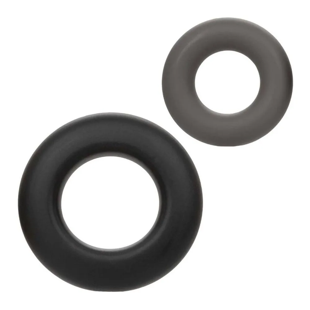 Deux anneaux en silicone noir de diamètres différents, en vue de face sur fond blanc, l'un plus grand à gauche, l'autre plus petit à droite