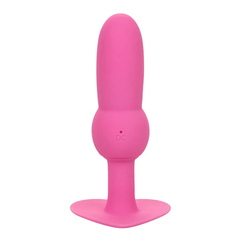 Sonde anale rose vif en silicone avec tête arrondie perlée, tige fine et base évasée en forme de cœur, sur fond blanc