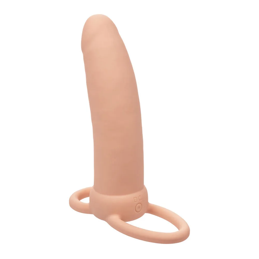 Double godemichet en silicone beige clair avec un shaft légèrement incurvé et deux anneaux de pénétration à la base, sur fond blanc