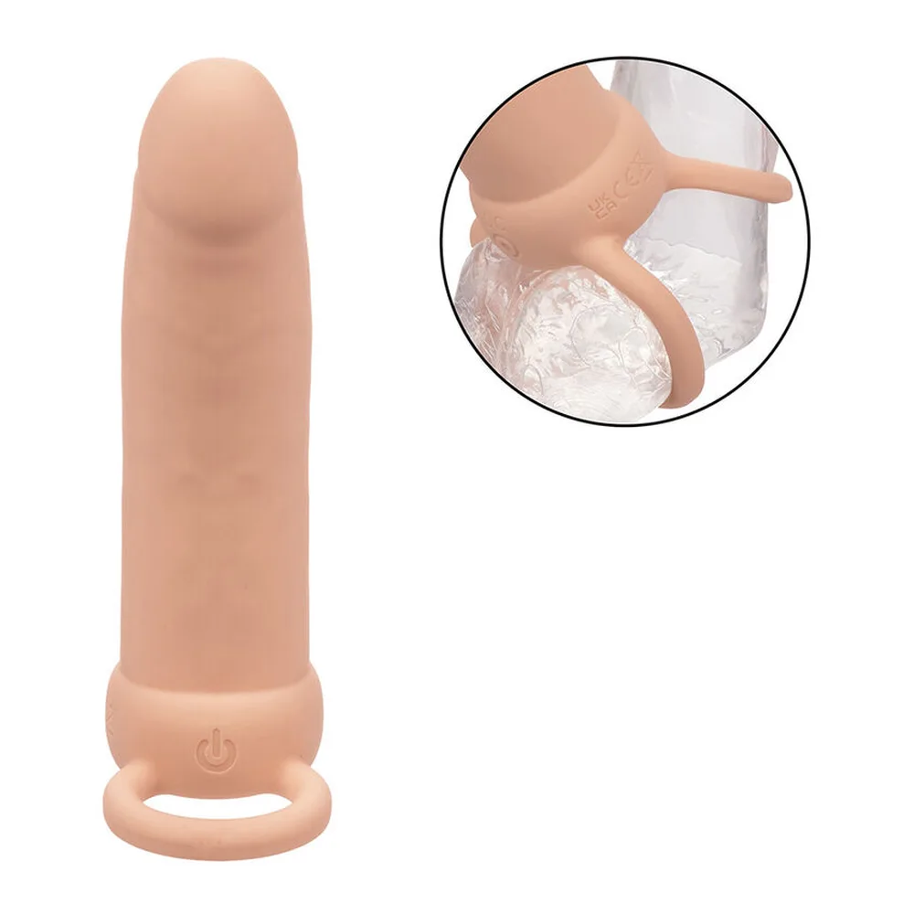 Double godemichet en silicone beige clair avec un shaft légèrement incurvé et deux anneaux de pénétration à la base, sur fond blanc
