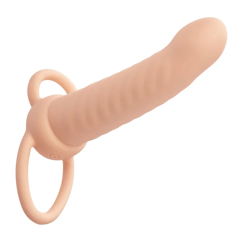 Double pénétrateur en silicone beige avec tige nervurée et base en forme de cœur dotée de deux anneaux de port